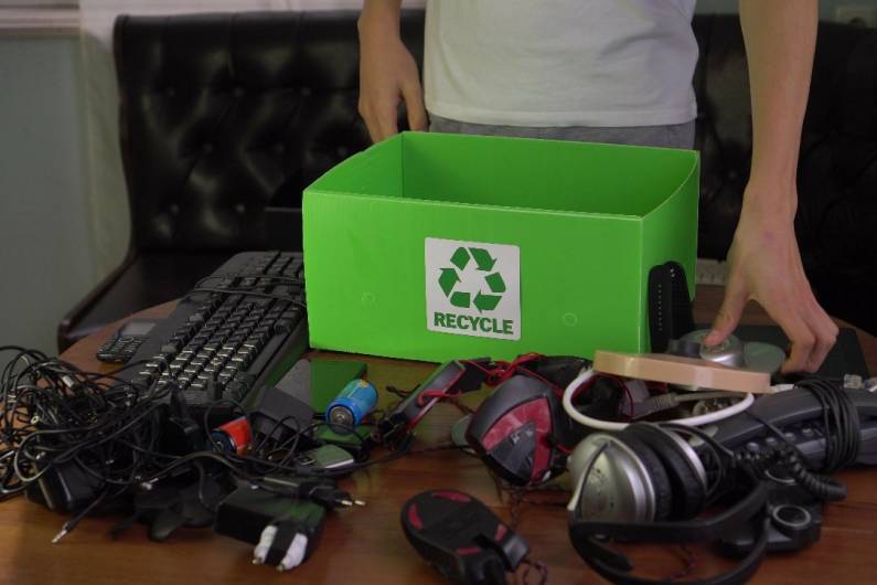 man collecting e-waste for recycling