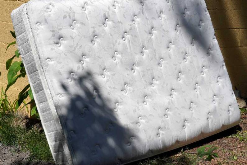 mattress kept outside for disposal